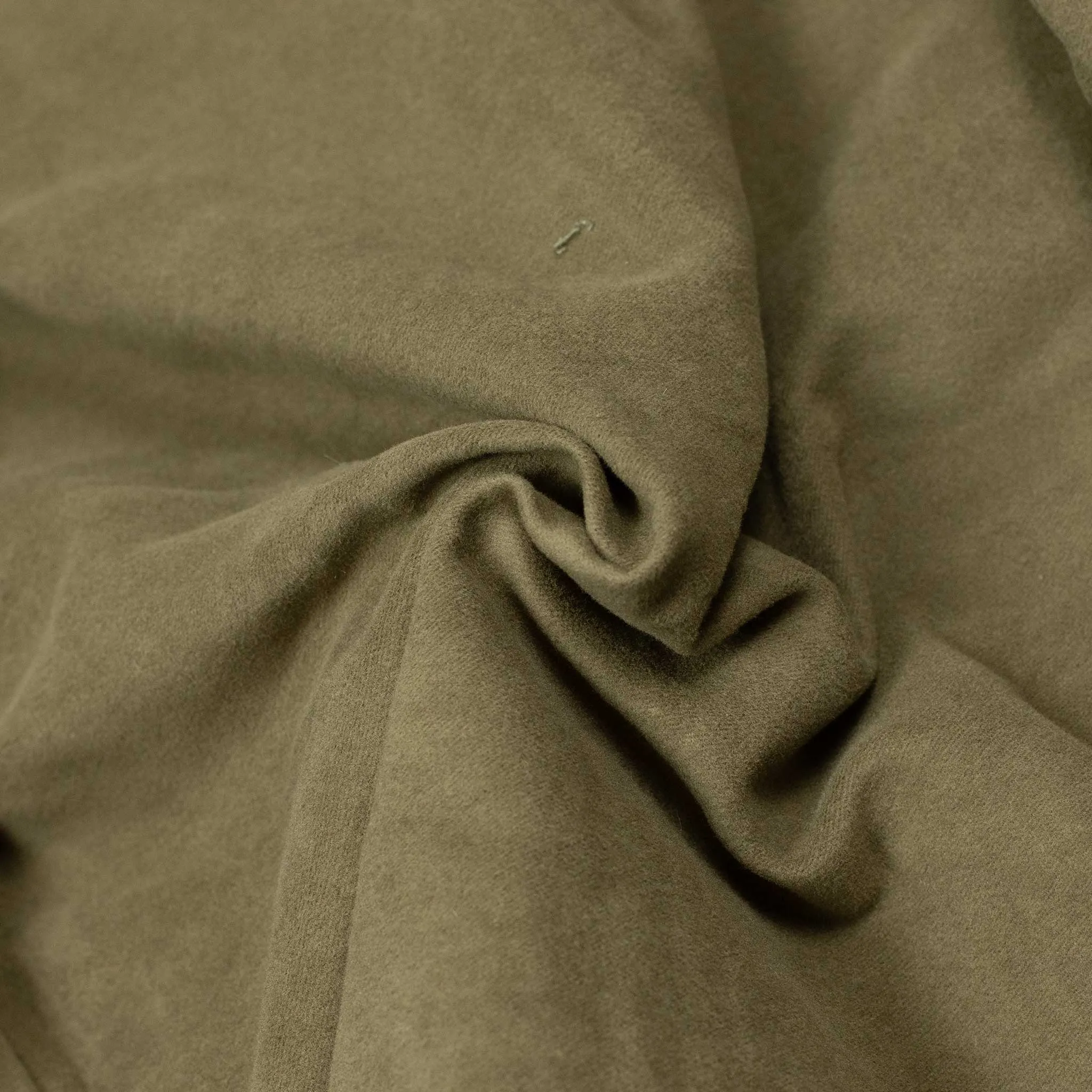 Reversible wadded gilet in fern green moleskin and dry wax cotton