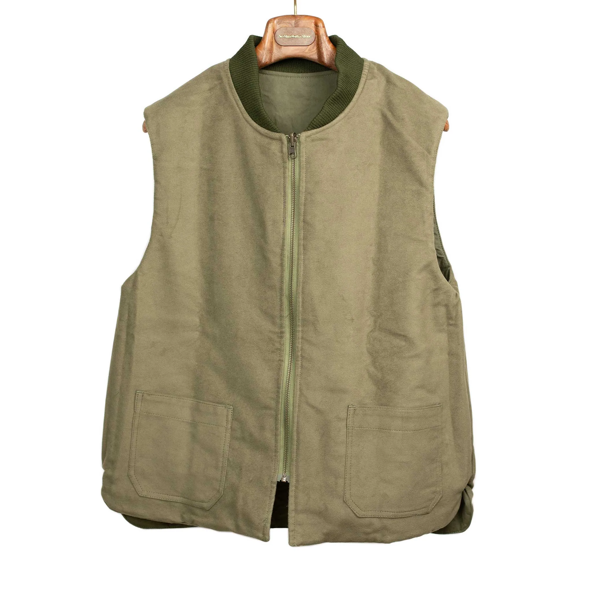 Reversible wadded gilet in fern green moleskin and dry wax cotton