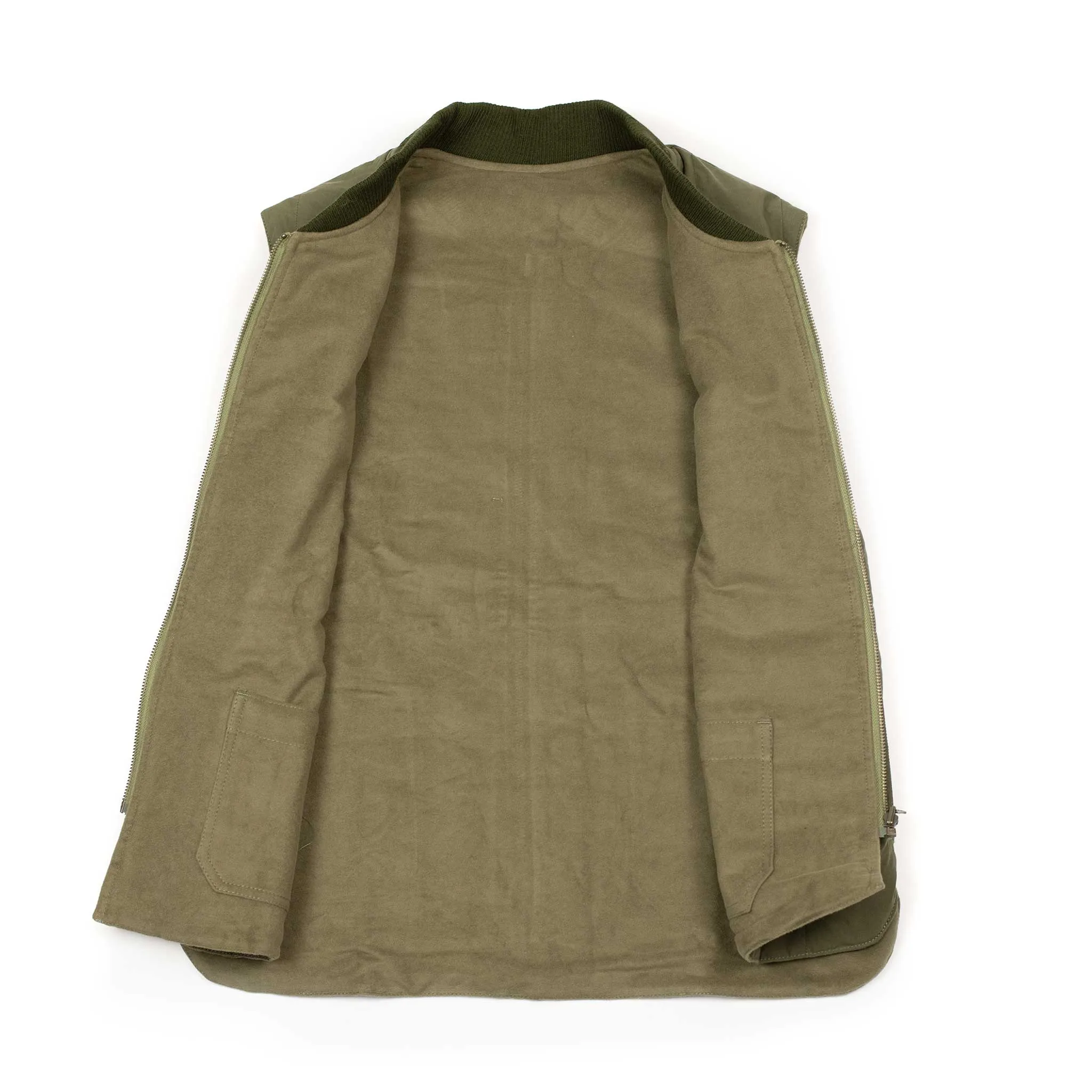 Reversible wadded gilet in fern green moleskin and dry wax cotton