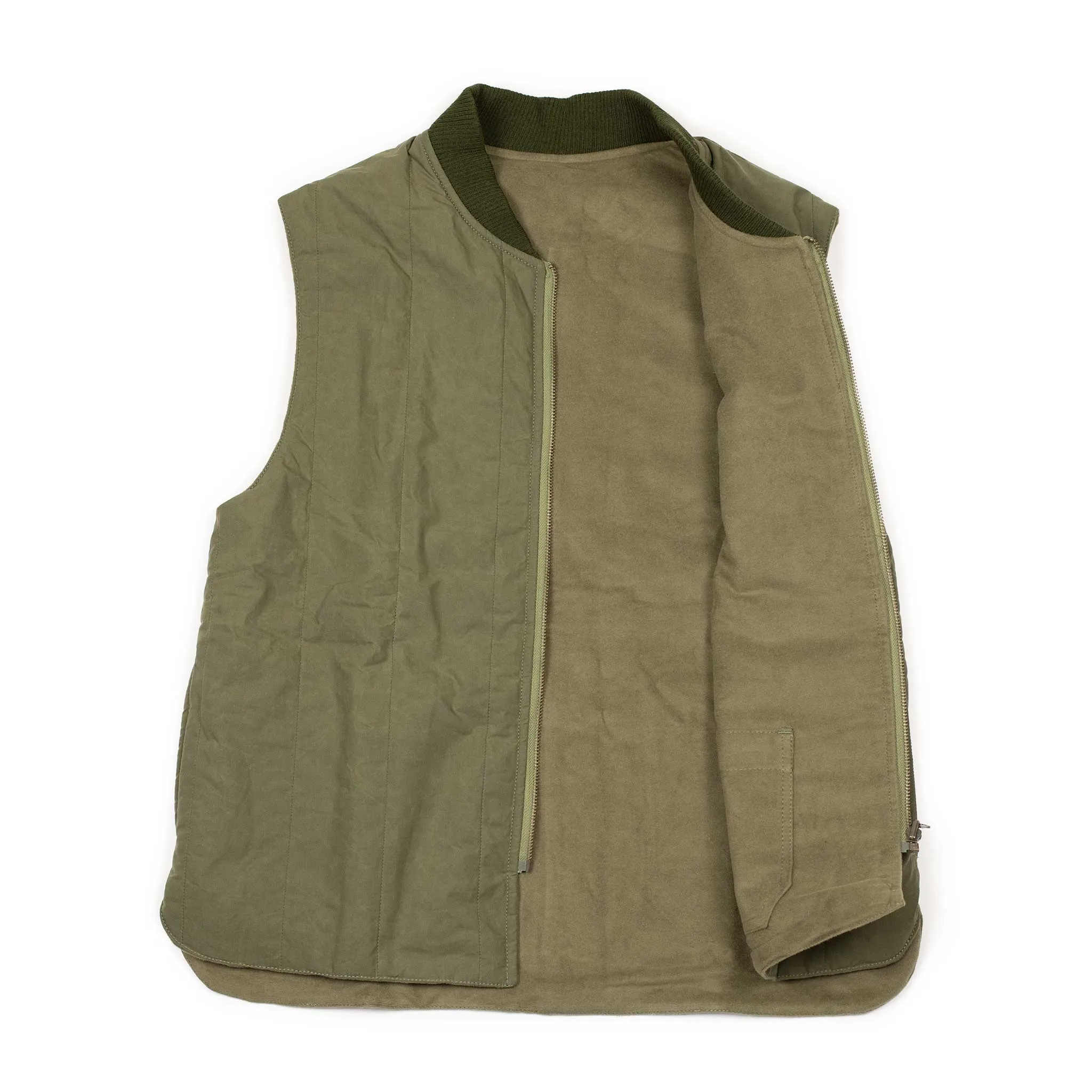 Reversible wadded gilet in fern green moleskin and dry wax cotton