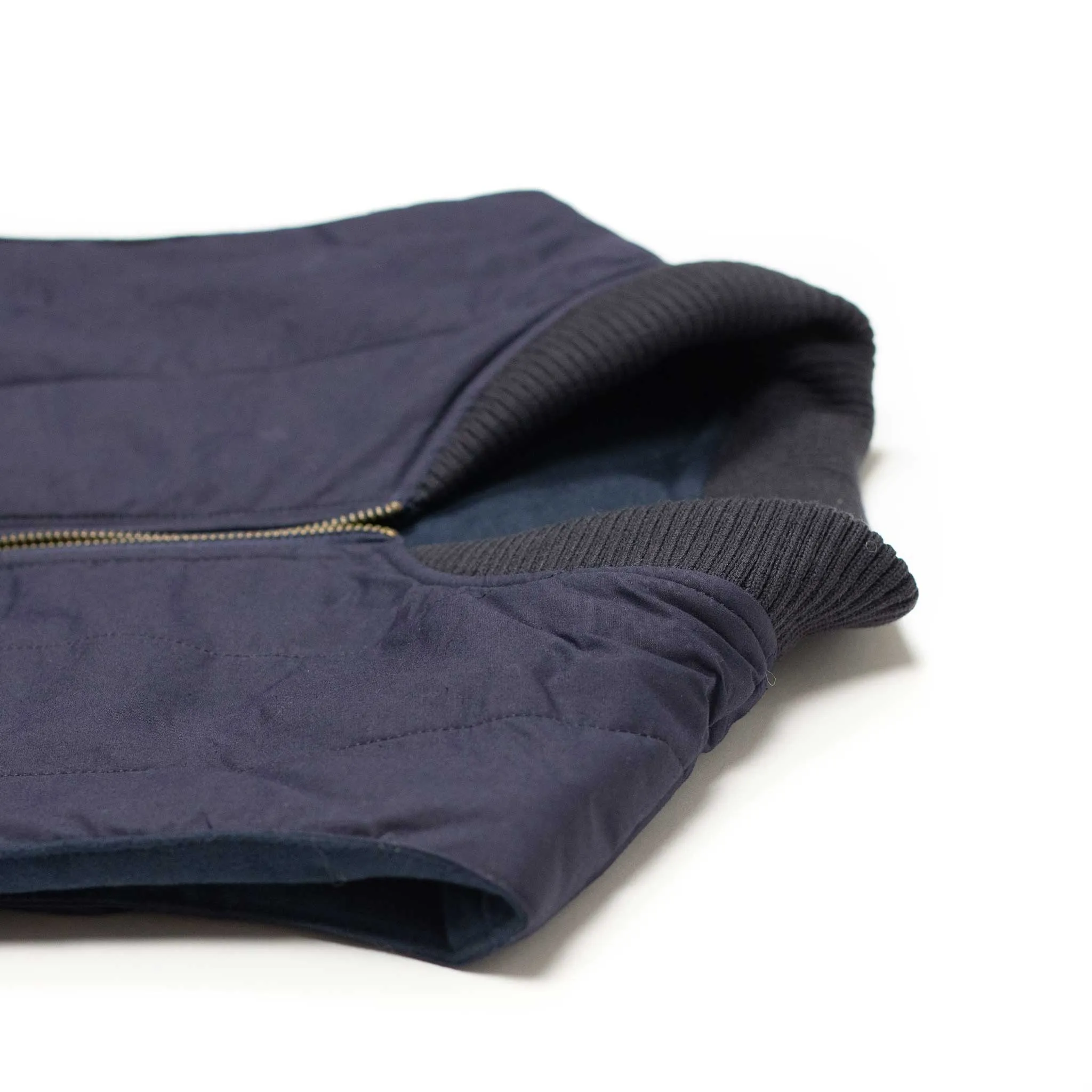 Reversible wadded gilet in navy moleskin and dry wax cotton