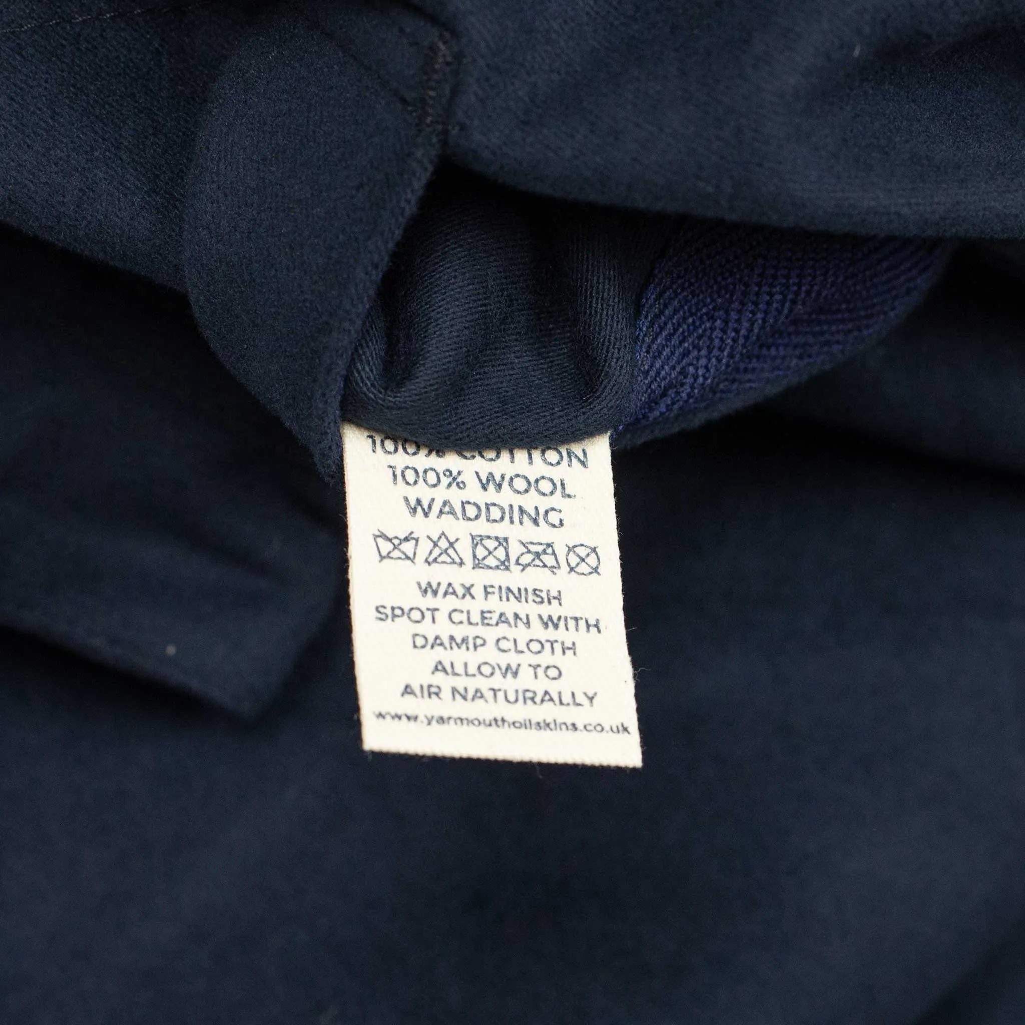 Reversible wadded gilet in navy moleskin and dry wax cotton