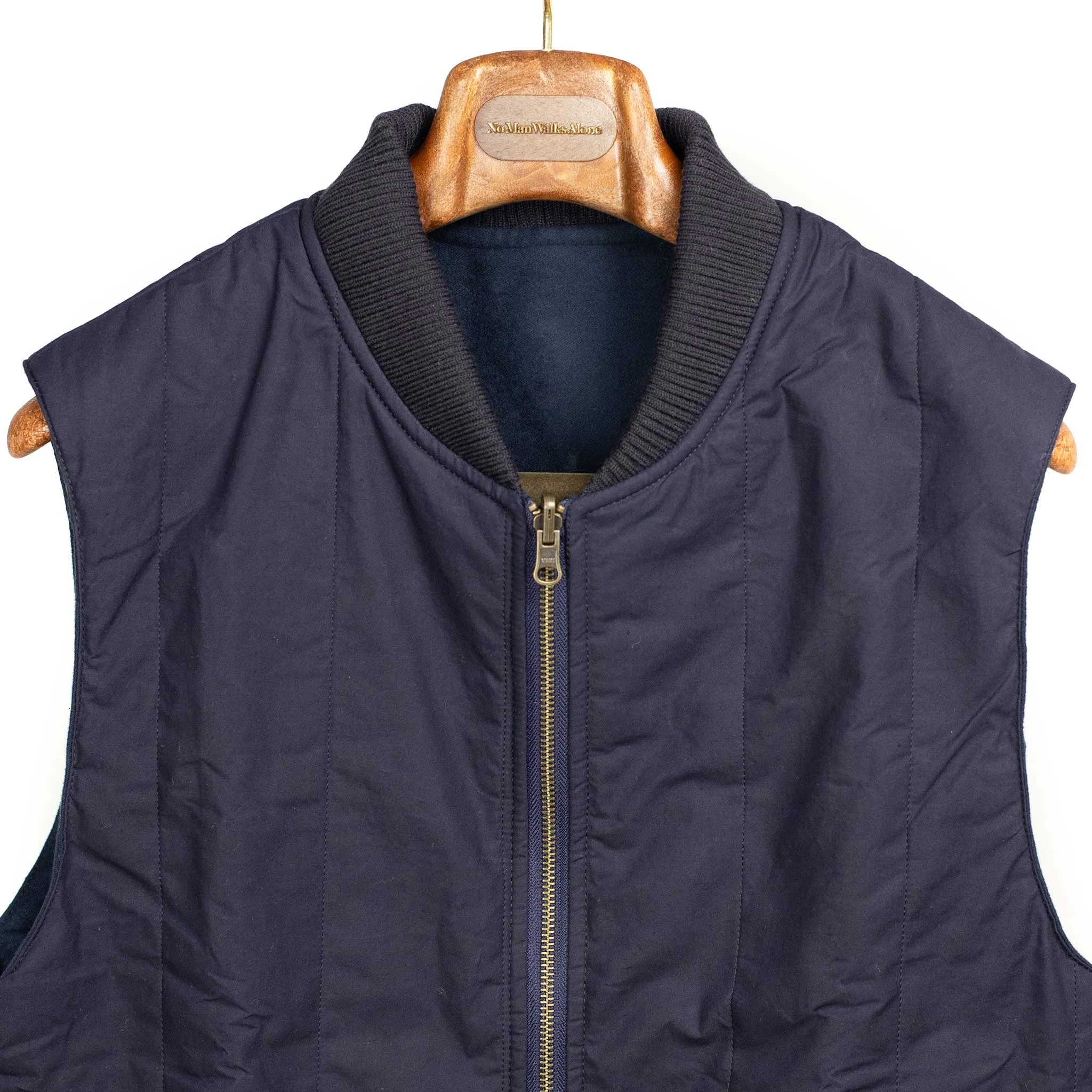 Reversible wadded gilet in navy moleskin and dry wax cotton