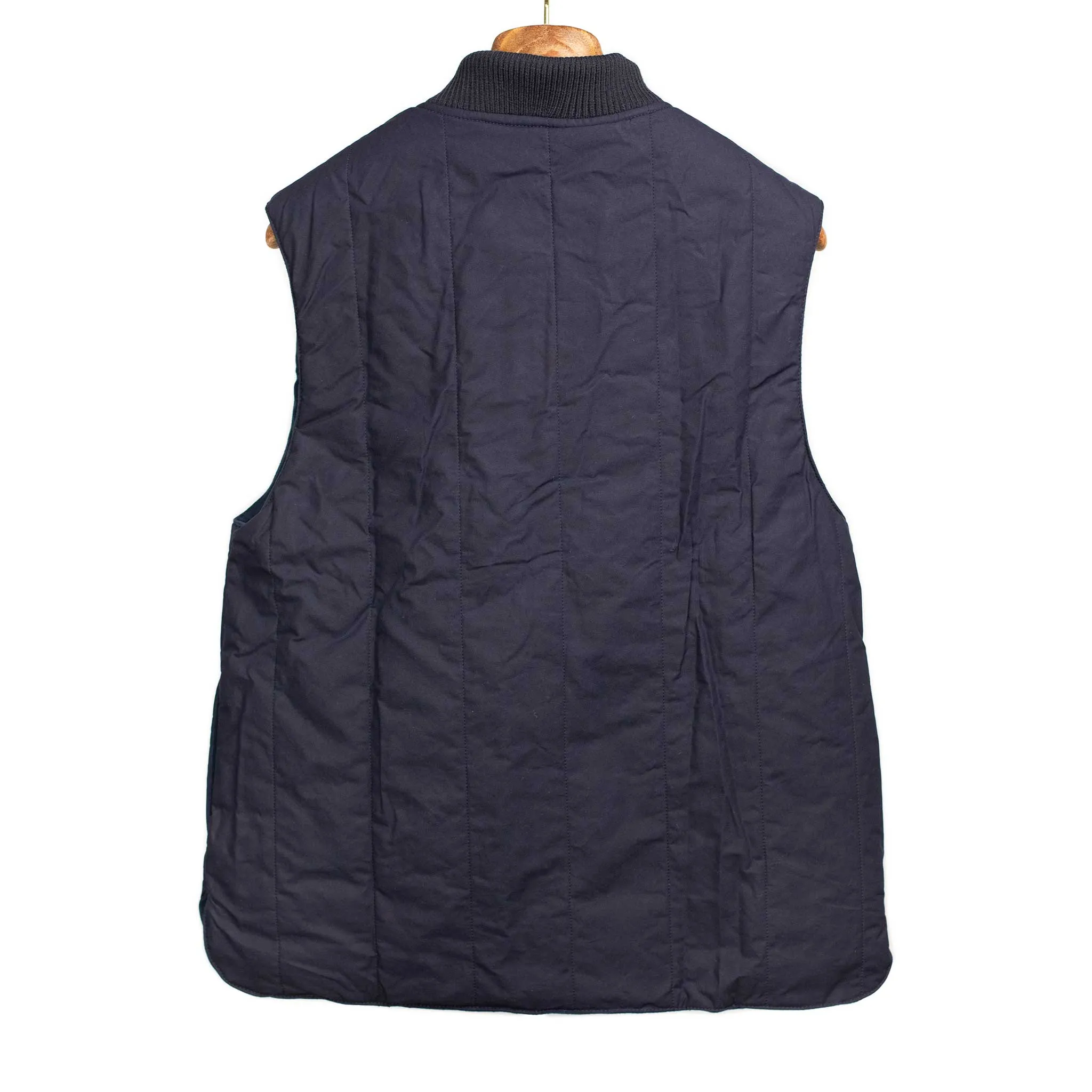 Reversible wadded gilet in navy moleskin and dry wax cotton