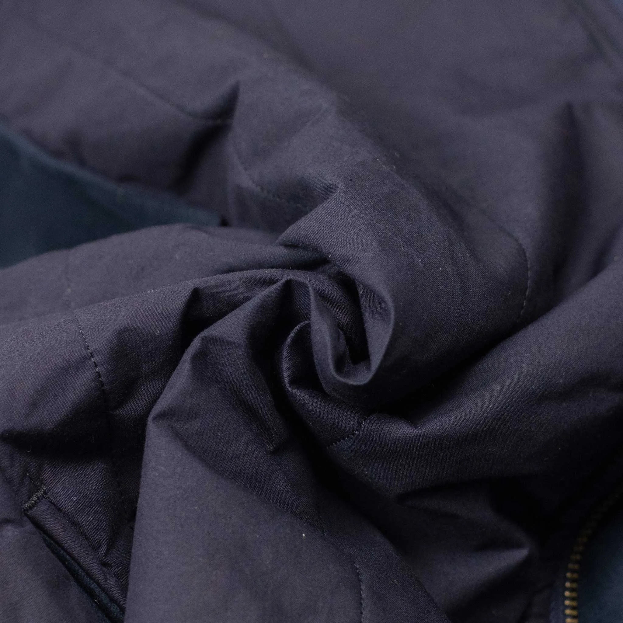 Reversible wadded gilet in navy moleskin and dry wax cotton