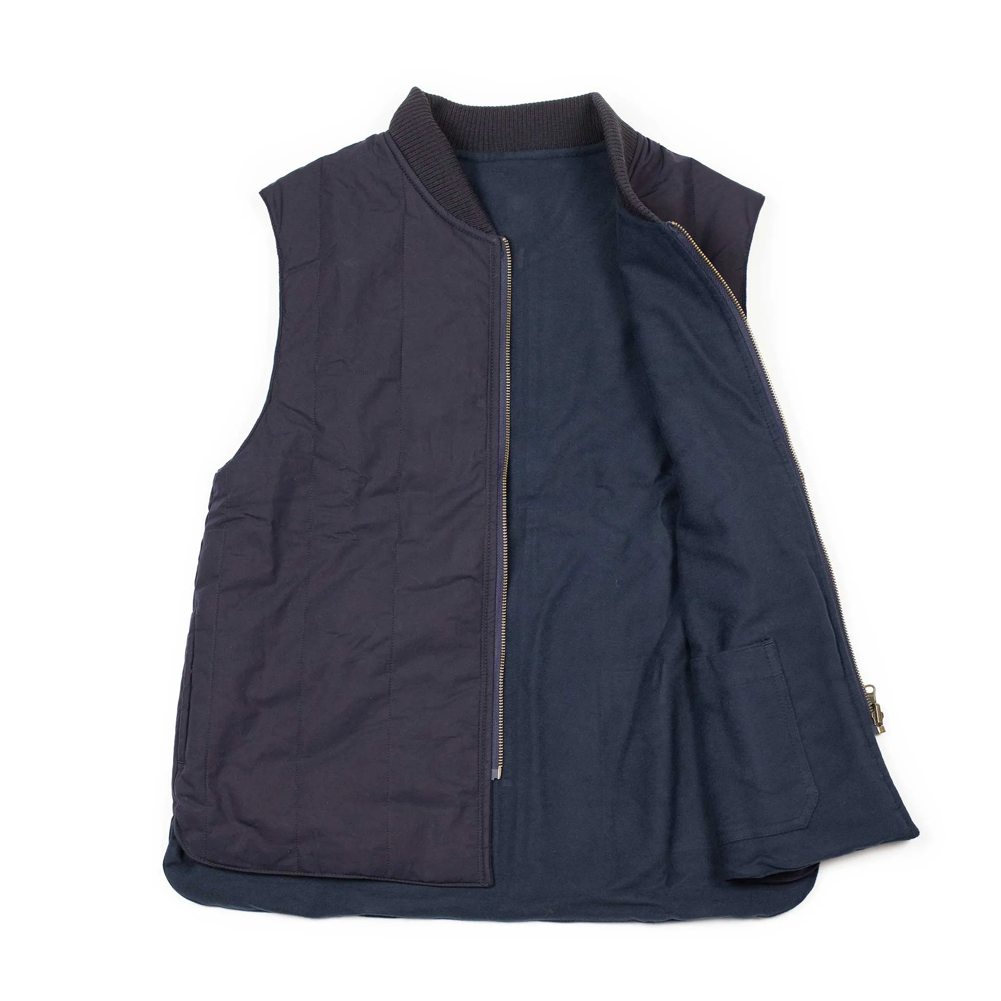 Reversible wadded gilet in navy moleskin and dry wax cotton